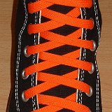 Orange Classic Shoelaces  Black high top with orange laces.