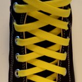 Classic Yellow Shoelaces  Black high top with classic yellow laces.