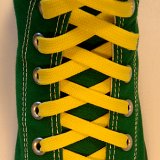 Classic Yellow Shoelaces  Green high top with classic yellow laces.