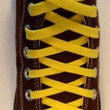 Classic Yellow Shoelaces  Chocolate brown high top with classic yellow laces.
