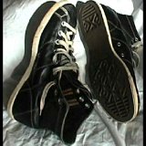 Collectors Items  Vintage black leather high tops, side and sole views.