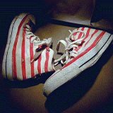 Collectors Items  Red and white zebra pattern high tops, outside views.