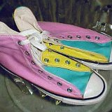 Collectors Items  Tricolor high tops in pink, yellow, and teal, top view.