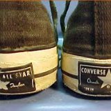 Collectors Items  Worn vintage black high tops, view of rear heel patches.