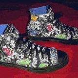 Collectors Items  Monochrome black "Weird Frog" high tops, side views.