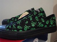 Chucks With Commercial Pattern Uppers  Side view of green and black Jackass low cuts.