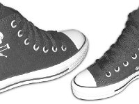 Chucks With Commercial Pattern Uppers  Angled side views of black canvas Jackass high tops.