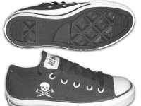 Chucks With Commercial Pattern Uppers  Side and sole views of black canvas Jackass low cuts.
