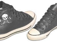 Chucks With Commercial Pattern Uppers  Angled side views of black leather Jackass high tops.