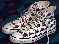 Chucks With Commercial Pattern Uppers  Planet Hollywood pattern high tops, angled outside view.