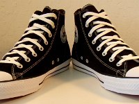 CTAS Cons Black High Tops  Angled front view of CTAS Cons black high tops.
