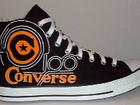 Converse Century Print High Top Chucks  Outside view of a right black, white, and orange century print high top.