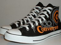 Converse Century Print High Top Chucks  Angled side view of black, white, and orange century print high tops.