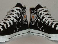 Converse Century Print High Top Chucks  Angled front view of black, white, and orange century print high tops.