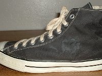 Converse Vintage Shoes  Outside view of a left Converse Coach black high top.