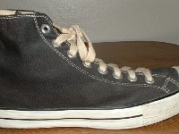 Converse Vintage Shoes  Outside view of a right Converse Coach black high top.