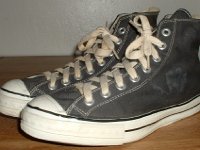 Converse Vintage Shoes  Angled side view of Converse Coach black high tops.