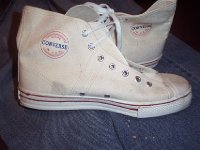 Converse Vintage Shoes  Inside patch views of white Converse canvas high tops.