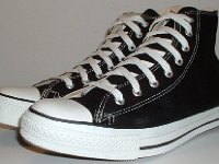 Core Black High Top Chucks  Angled side view of black high top chucks.