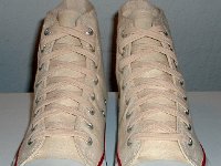 Core Natural (Unbleached) White High Top Chucks  Angled front to top view of natural white high tops.