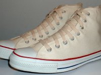 Core Natural (Unbleached) White High Top Chucks  Angled side view of natural white high tops.
