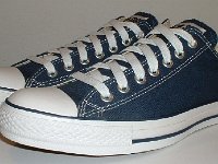 Core Navy Blue Low Cut Chucks  Angled side view of navy blue low cut chucks.