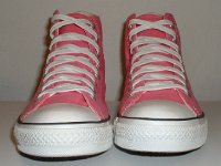 Core Pink High Top Chucks  Front view of pink high tops.