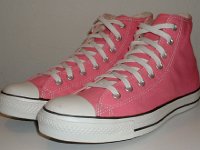 Core Pink High Top Chucks  Angled side view of pink high tops.