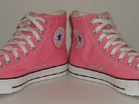 Core Pink High Top Chucks  Angled front view of pink high tops.