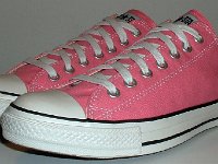 Core Pink Low Cut Chucks  Angled side view of pink low cut chucks.