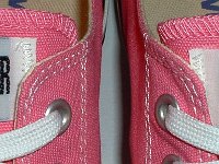 Core Pink Low Cut Chucks  Closeup of the All Star labels on pink low cut chucks.