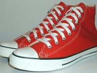 Core Red High Top Chucks  Angled side view of red high tops.