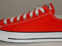 Core Red Low Cut Chucks  Outside view of a left red low cut chuck.
