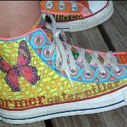 Custom Painted High Top Chucks  Custom design featuring a butterfly and mosaic pattern, right outside and partial left inside views.