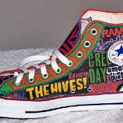 Custom Painted High Top Chucks  Inside patch view of Seth's right high top showing his favorite bands.