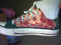 Chucks With Custom Print Pattern Uppers  Side view of a right floral print low cut.