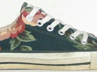 Chucks With Custom Print Pattern Uppers  Side view of a right floral prinit low cut.