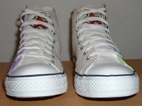 Chucks With Custom Print Pattern Uppers  Front view of white graffiti high tops.
