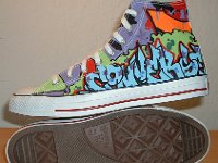 Chucks With Custom Print Pattern Uppers  Sole and inside patch views of white graffiti high tops.