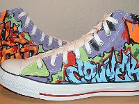 Chucks With Custom Print Pattern Uppers  Outside views of white graffiti high tops.