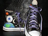 Chucks With Custom Print Pattern Uppers  Top and side views of outer space print high tops.