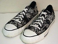 Chucks With Custom Print Pattern Uppers  Black and white graphic pattern low cuts, angled top and side views.