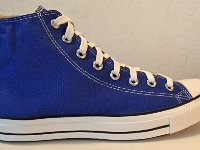 Dazzling Blue High Top Chucks  Outside view of a right dazzling blue high top chuck.