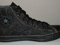 Denim Chuck Taylors  Inside patch view of a left black charcoal stitched denim high top chuck.