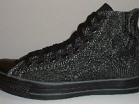 Denim Chuck Taylors  Outside view of a left black charcoal stitched denim high top chuck.