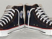 Denim Chuck Taylors  Navy blue coated denim high tops, angled front view.