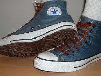 Denim Chuck Taylors  Wearing light blue coated denim high tops, inside patch and sole views.