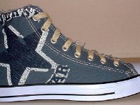 Denim Chuck Taylors  Right denim blue graphic star high top, outside view.