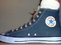 Denim Chuck Taylors  Wearing blue denim graphic star high tops, right inside patch view.