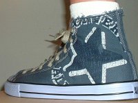 Denim Chuck Taylors  Wearing a denim blue left graphic star high top.